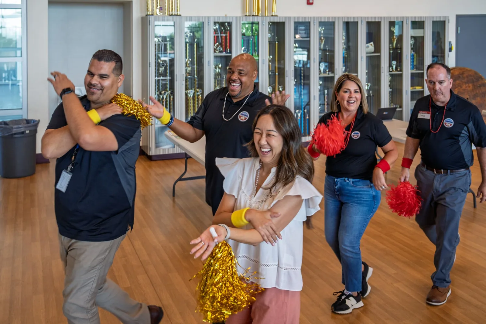 A district team laughing mid-challenge during an UNLOCK session